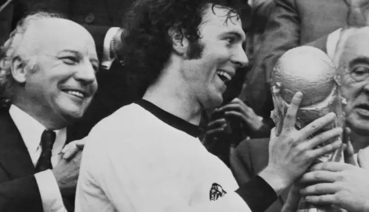 Franz Beckenbauer passed away at the age of 78 Franz Beckenbauer holding FIFA World Cup