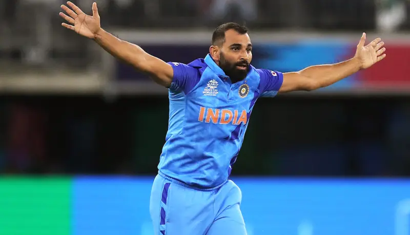 India's Mohammed Shami is celebrating the wicket.