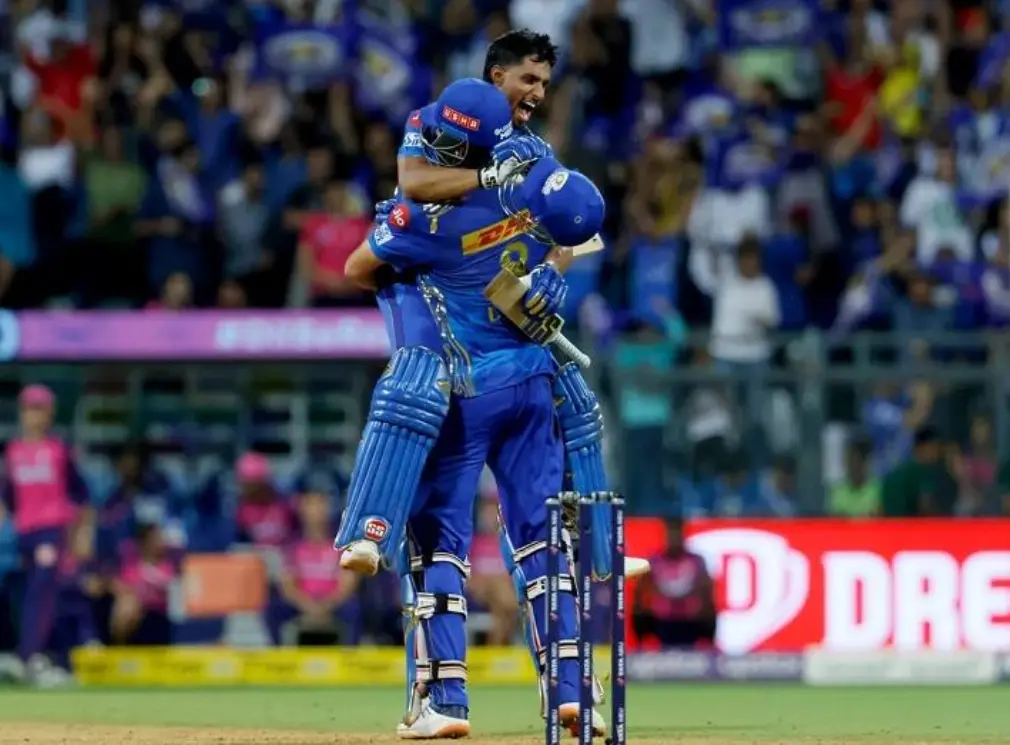 Mumbai Indians' Tilak Varma and Tim David celebrating after victory