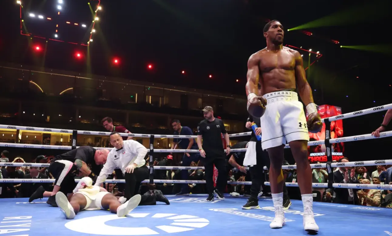 What Next For Francis Ngannou After His KO Loss To Anthony Joshua? Anthony Joshua walking after knocking out Francis Ngannou