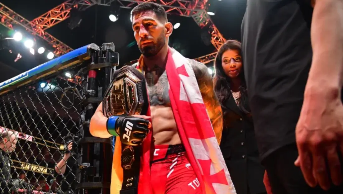 Ilia Topuria exiting from the octagon after win
