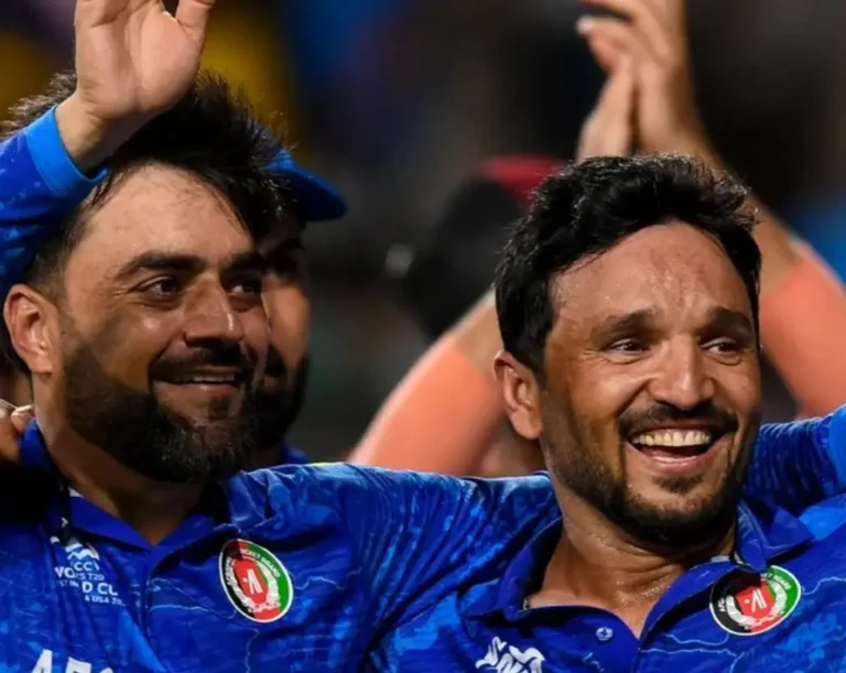 Rashid Khan and Gulbadin Naib celebrating after victory