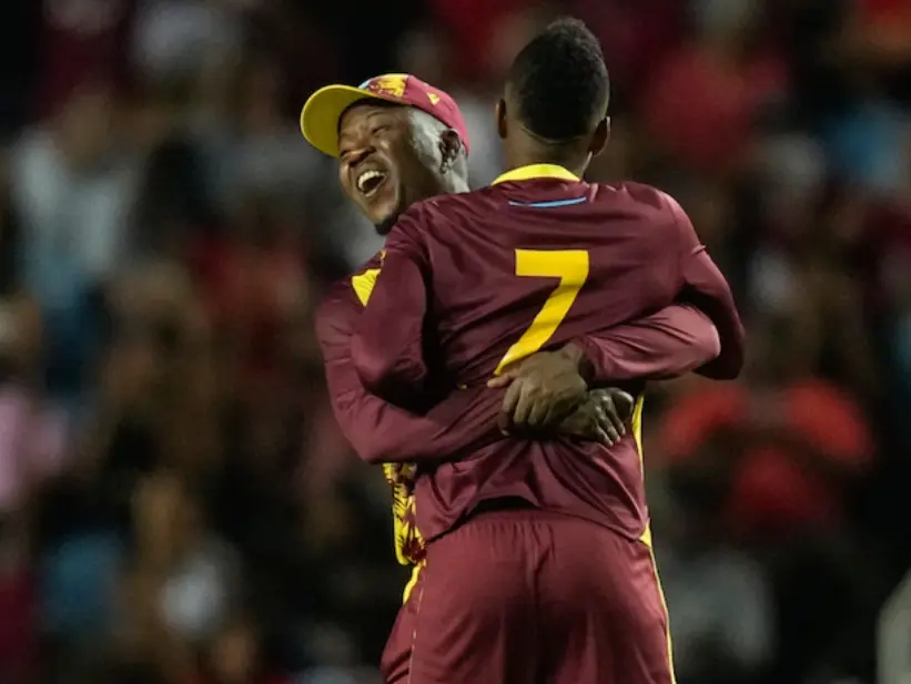 Sherfane Rutherford hugging Akeal Hosein