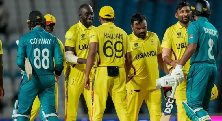 Uganda players and New Zealand players shaking hands post-match