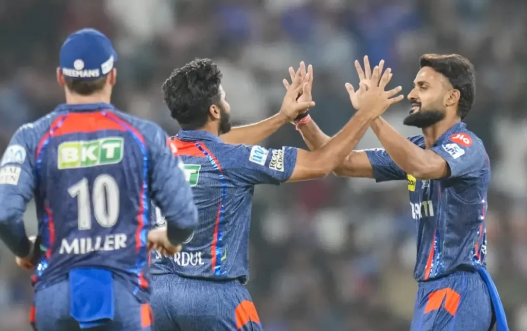Shardul Thakur with LSG team players during an IPL match