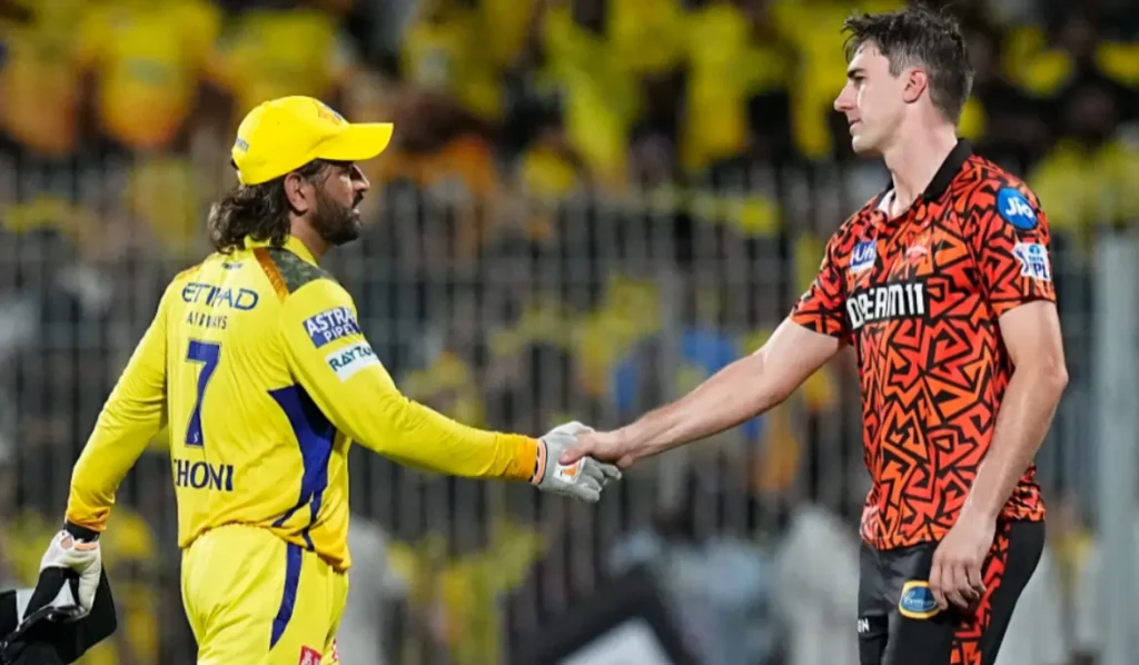 Pat Cummins and MS Dhoni during an IPL match