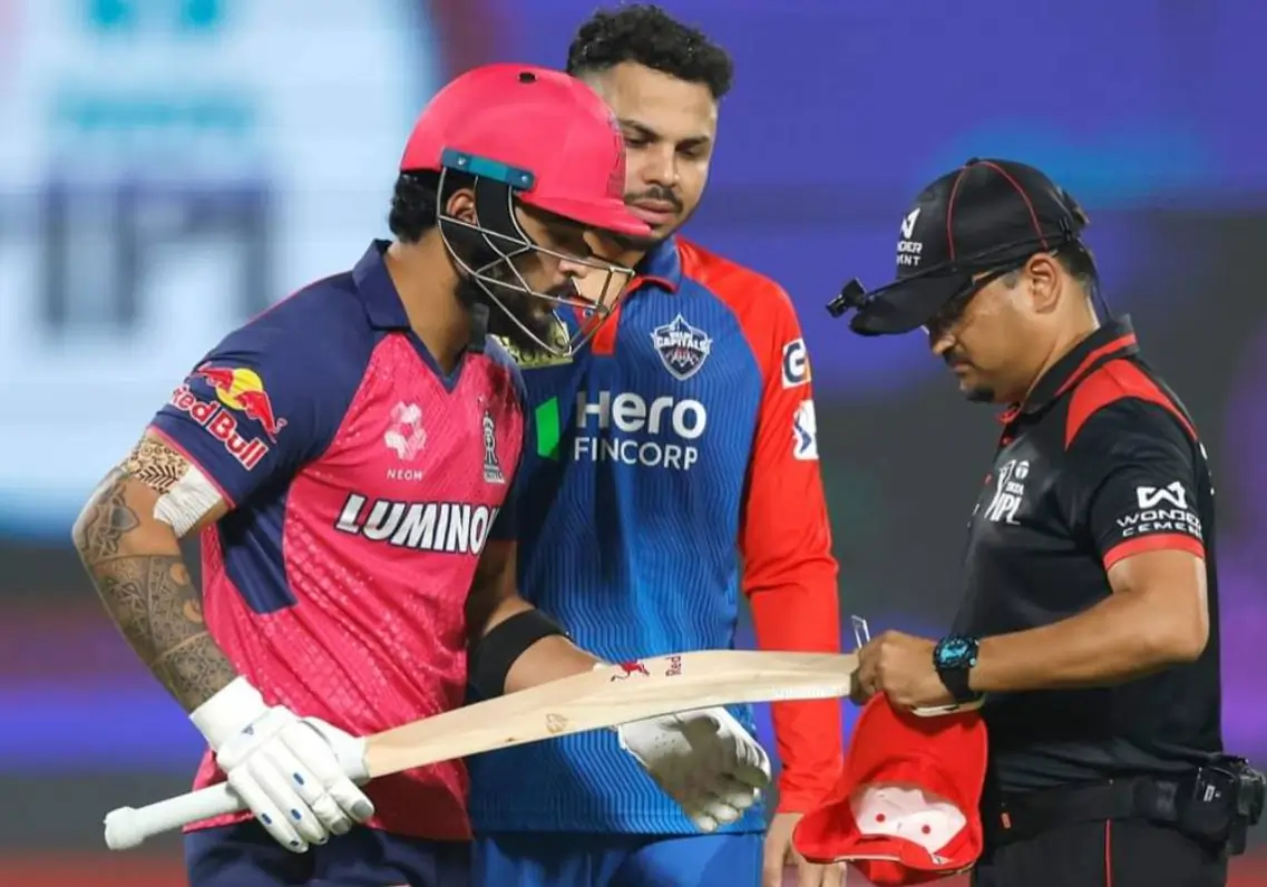 What Is On-Field Gauge Test? Why Umpires Check Batters’ Bat During Match? Riyan Parag during an on-field gauge test
