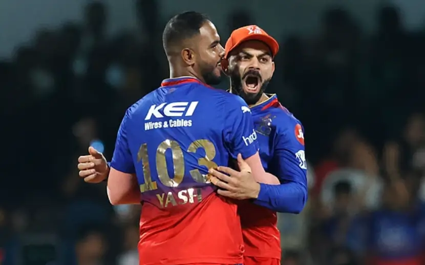 Virat Kohli and Yash Dayal during an IPL match