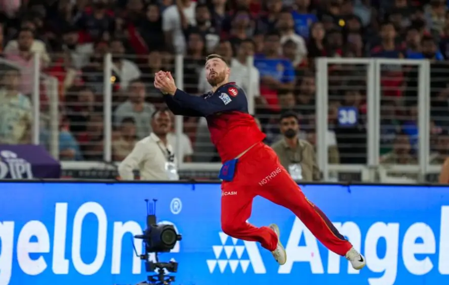 PhiL Salt taking a catch during an IPL match